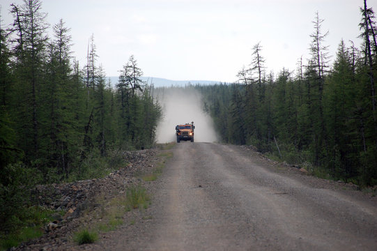 Truck at Chukotka gravel road taiga area