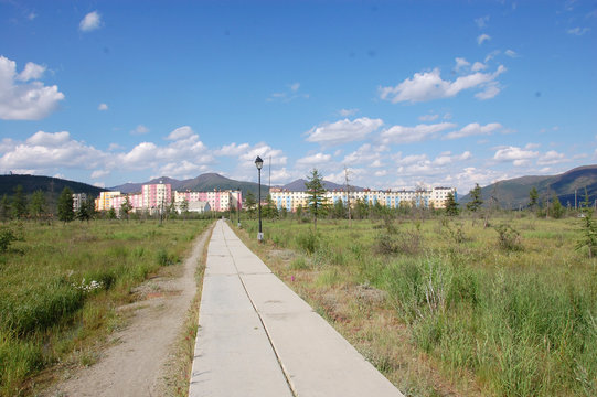 Flagstone pathway at tundra area near town district
