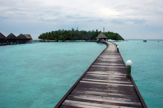 Timber pier at Maldives island resort