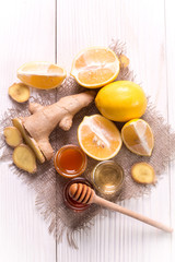 Tea,honey, lemon and ginger on wooden table.healthy food.