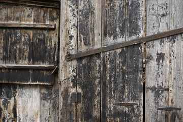 Old wooden door made up of wooden slats