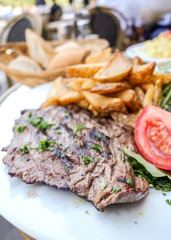 juicy steak beef meat with tomato and french fries