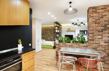 Interior studio apartments, with a kitchen and wooden floors