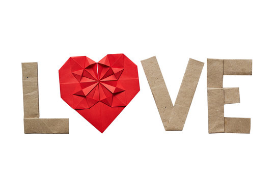 Origami text LOVE on white background isolated. Space for copy, lettering. Red paper heart. No shaddow.