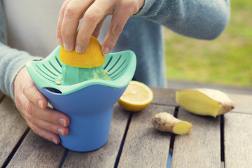 woman squeezing a lemon
