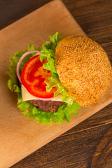 Top view bbq hamburger on the wooden background