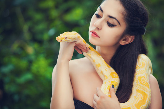 sexy woman holding python