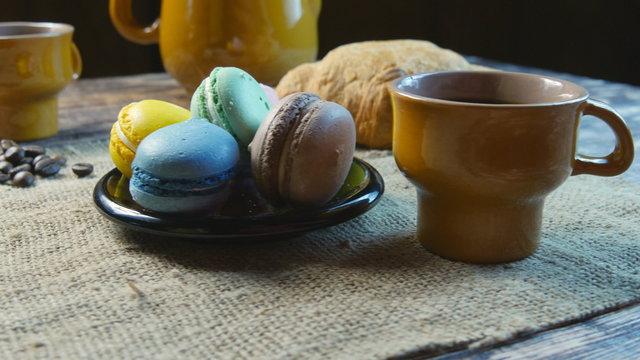 Black coffee and macarone  turning around