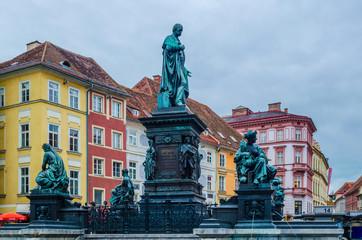Erzherzog Johann fountain at Hauptplatz square in Graz with colorful houses behind it