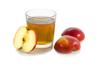 glass of apple juice with a slice of apple