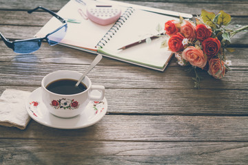 Vintage Film Look: cup of coffee with notebook