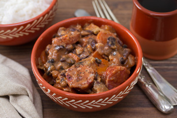 typical portuguese dish feijoada in ceramic bowl