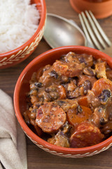 typical portuguese dish feijoada in ceramic brown bowl