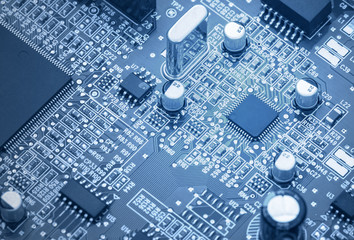 Circuit board with electronic components. Computer and networking communication technology concept. Tinted image.