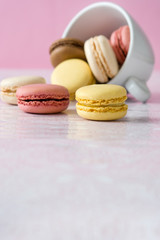 colorful macarons out of a cup