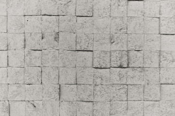 Elegant stone wall from small square parts. Closeup picture