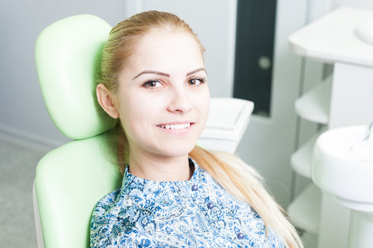 Cute female patient waiting in dental office