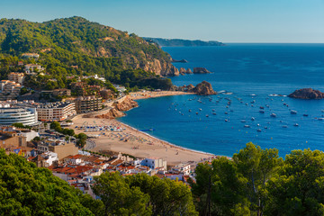 Fototapeta na wymiar Aerial view of Gran Platja beach and Badia de Tossa bay in Tossa de Mar on the Costa Brava, Catalunya, Spain