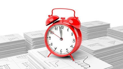 Red alarm cloack on stack of paperwork with graphs, isolated on white background.