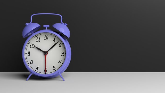 Retro lilac alarm clock set on surface, isolated on black background.