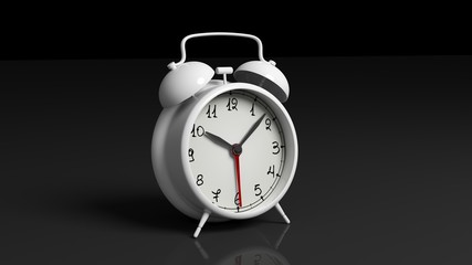 Retro white alarm clock, isolated on black background.