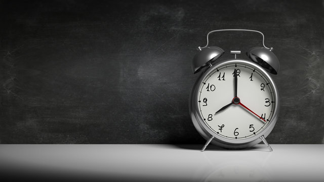 Retro silver alarm clock with blackboard and copy-space