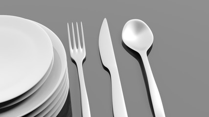 Silver fork, spoon and knife with a stack of plates, isolated on black background.