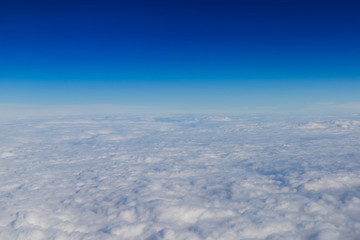 Fototapeta na wymiar Blue horizon and white clouds, aerial shot