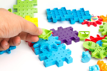 Plastic toy blocks on white background