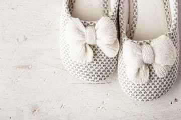 Slipper with bow on the white background top view