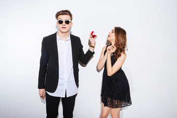 Man making proposal with ring to his girlfriend