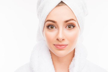 Young cute girl with towel on her head after shower