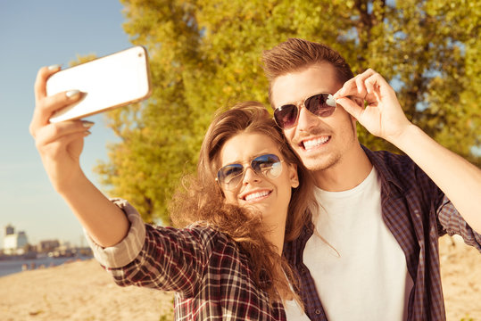 Young couple making selfie photo