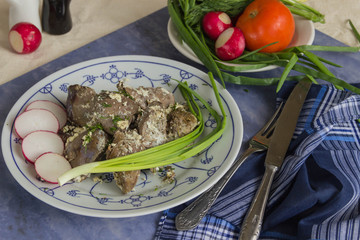 The turkey liver stewed in cream sauce and fresh vegetables(tomato,radish,onion)