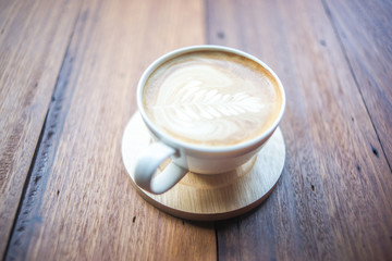 Coffee cup top view on old wooden