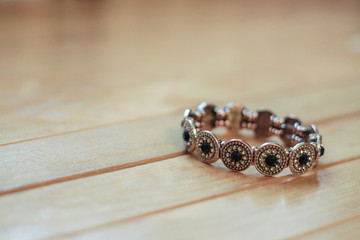 Bracelet on a wooden background