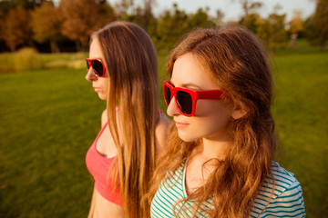 two sexy  girls with red glasses