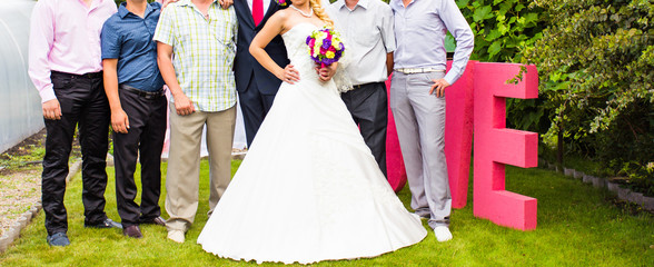 Groom and Bride With Best Man And Groomsmen At Wedding