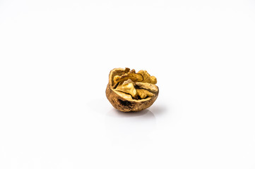Cracked walnut on a white background.