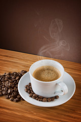 cup of coffee on brown background