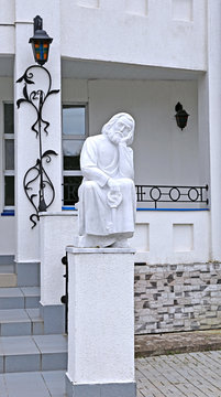 Statue of monk with key sitting in Raif monastery