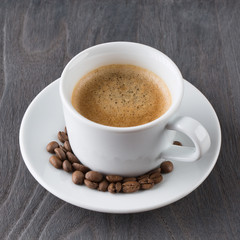 Cup of coffee on wooden background
