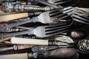 Vintage knives forks and spoons with a vintage style filter applied