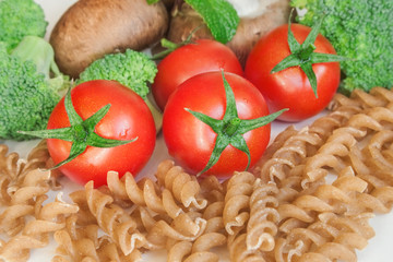Raw pasta and vegetables