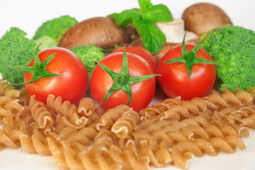 Raw pasta and vegetables