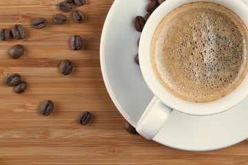 Coffee cup top view on wooden table background