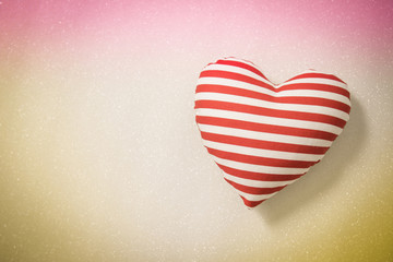 The heart shapes on abstract light glitter background in love concept for valentines day