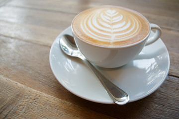 Cup of coffee on wooden table