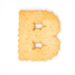 letter B made of cracker cookie isolated on white background.