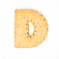 letter D made of cracker cookie isolated on white background.